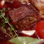 Julia Child's Beef bourguignon stew with chunks of meat floating in sauce