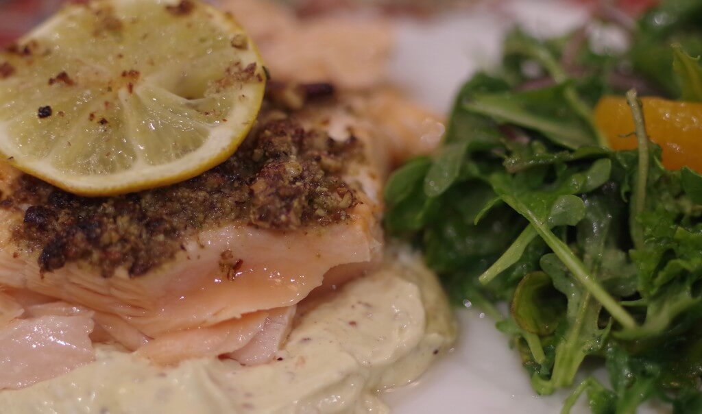 Pecan crusted salmon over mustard sauce with arugula orange salad. Inspired by Frazer's Restaurant St. Louis, MO.