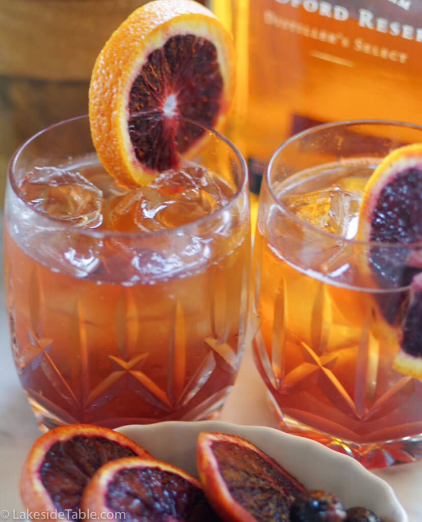 Old Fashion Cocktail Recipe - Put a little twist on a classic by using blood oranges and black maraschino cherries. So refreshing! | www.lakesidetable.com