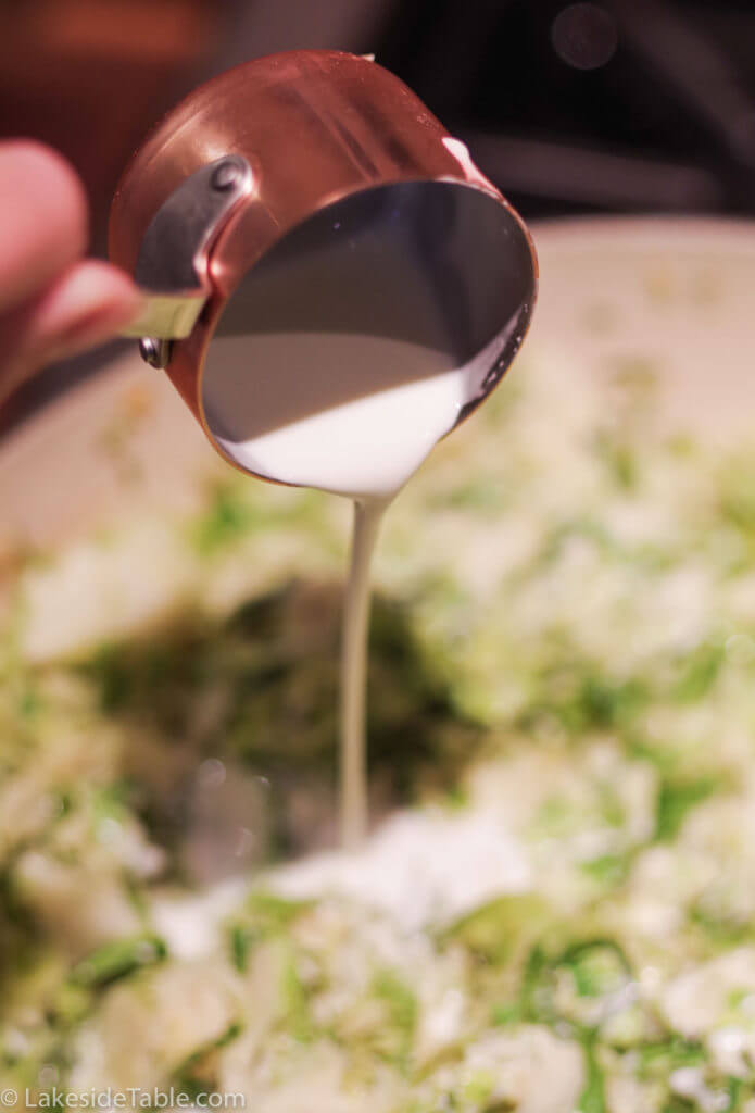 Easy Thanksgiving side dishes: pouring cream over brussels sprouts