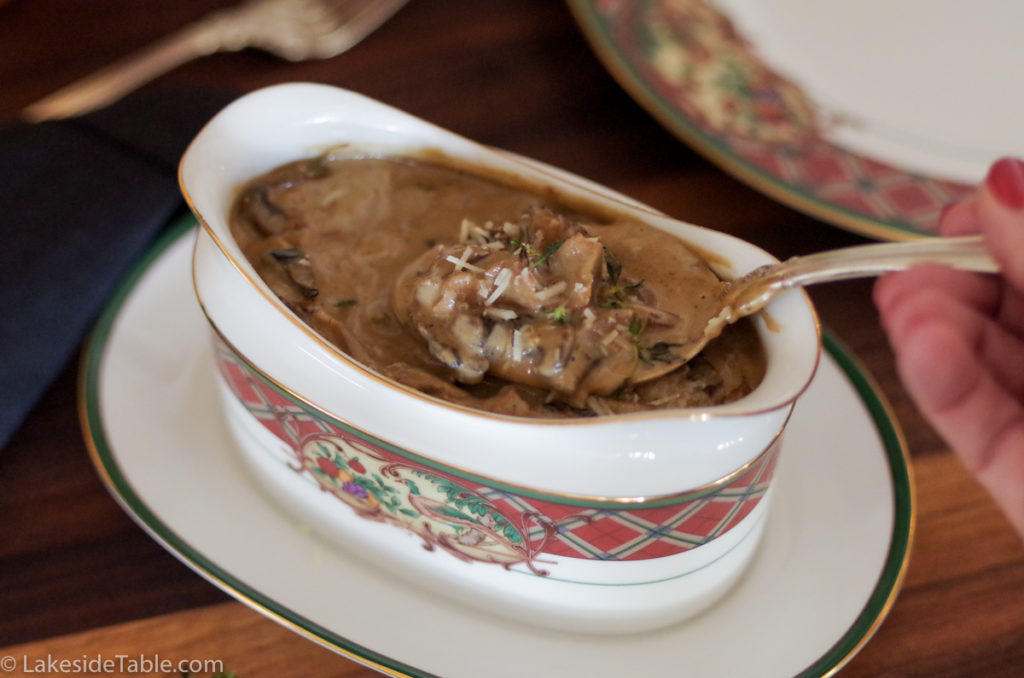 Easy Thanksgiving side dishes: tureen of dark mushroom sauce with a spoon
