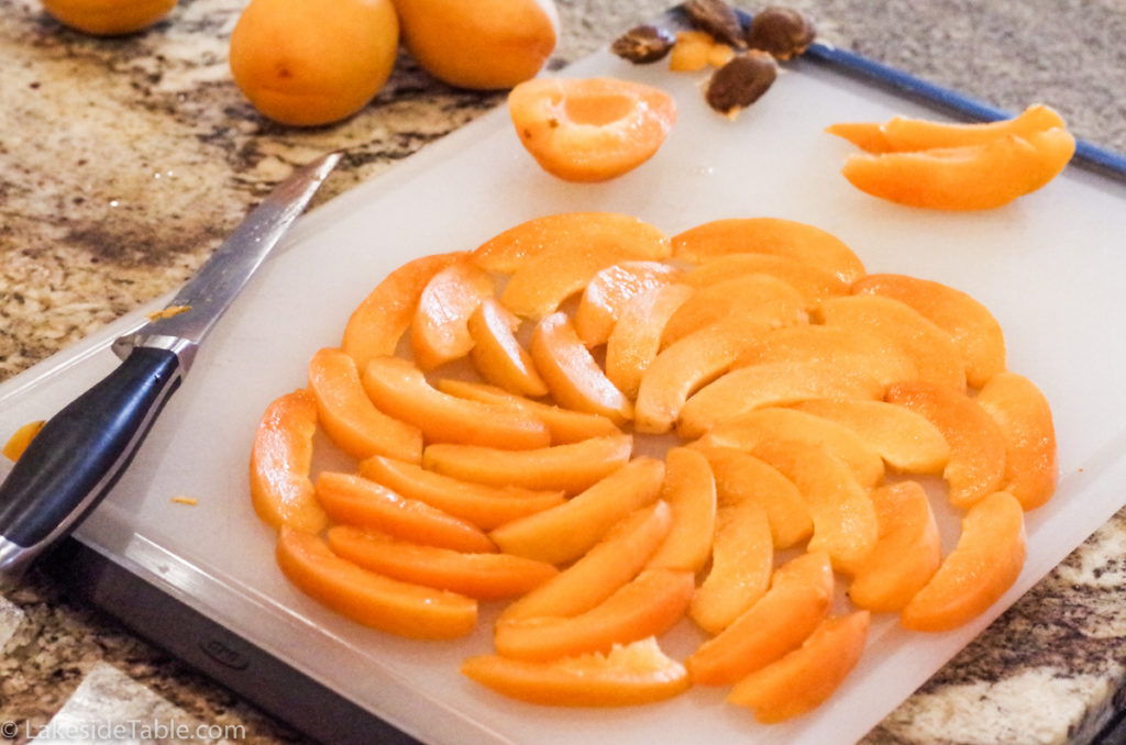 Practice arranging your fruit on a work space before placing it on the apricot tart.