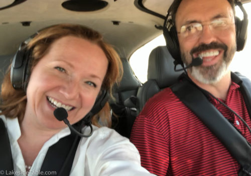two people in cockpit of cirrus sr22