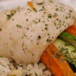 Put a different twist on your next fish dish... literally!  Light buttery fish wrapped gently around brightly colored veggies nestled over a bed of wild rice will make any weeknight seem like a special date night dinner. | www.lakesidetable.com