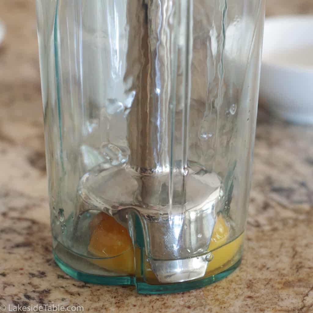 classic hollandaise sauce being made with immersion blender