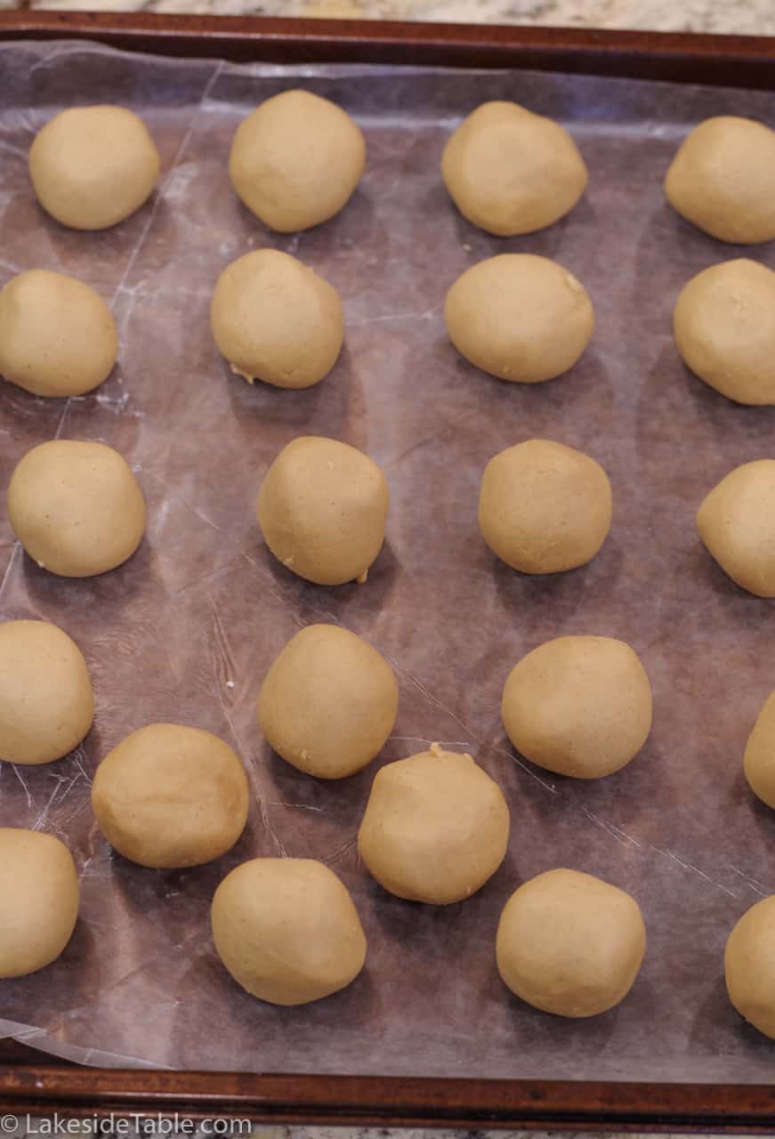 rolled peanut butter balls ready for freezer