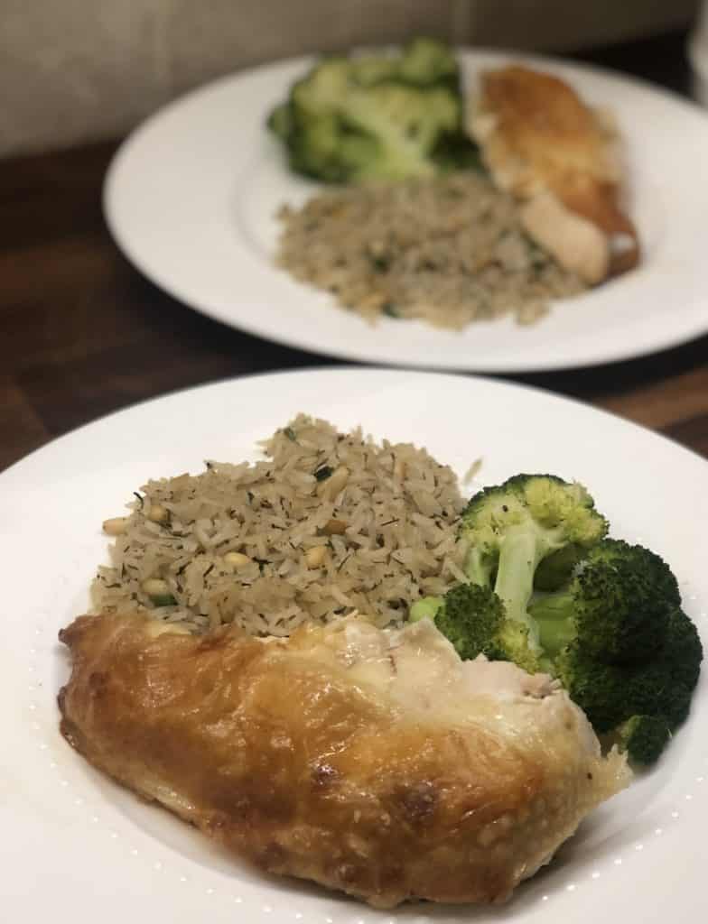 plate of roasted chicken, rice pilaf and steamed broccoli