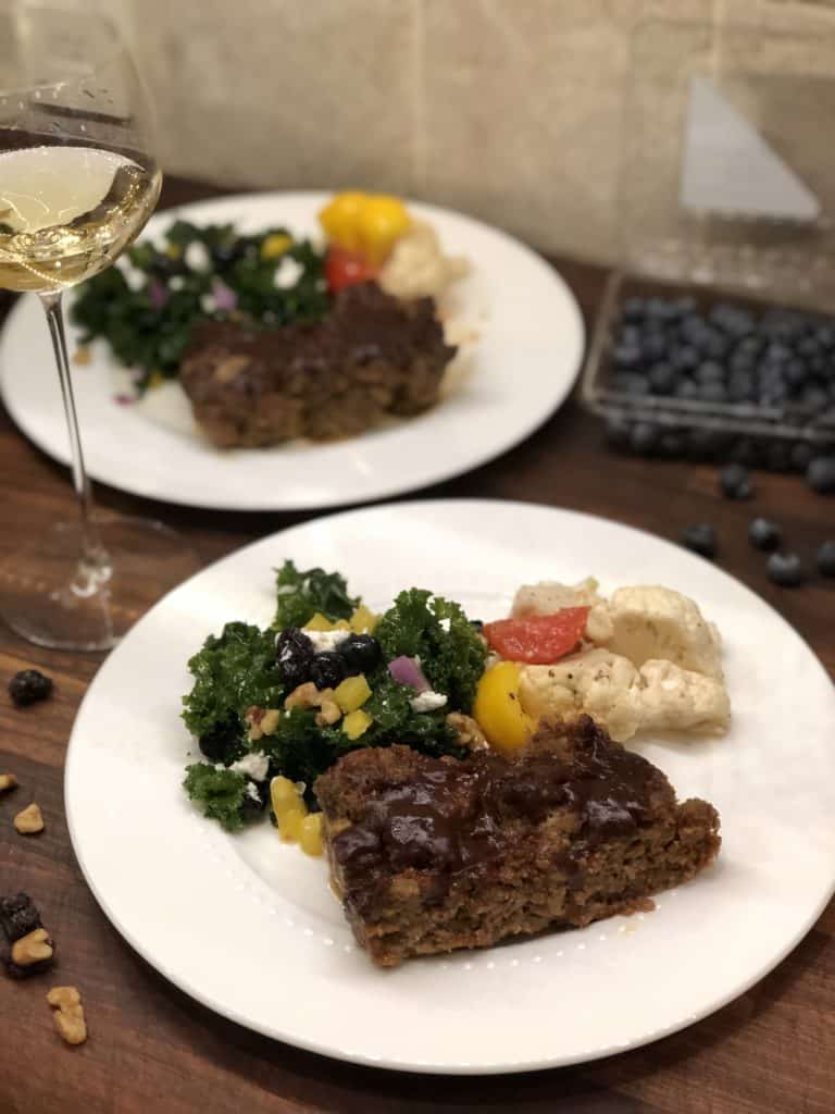 plated meatloaf with yogi kale salad and veggies