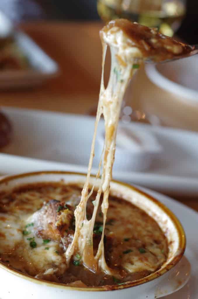 easy French onion soup with beef broth topped with cheese, parsley and garlic from the firefly grill effingham il