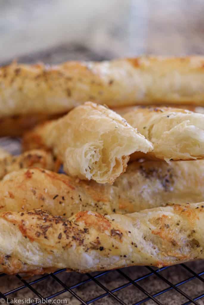 close up of flakey inside garlic parmesan bread twists made with puff pastry