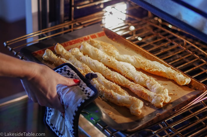 garlic parmesan breadsticks coming out of oven