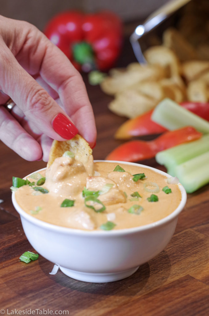 dipping corn chip into dip