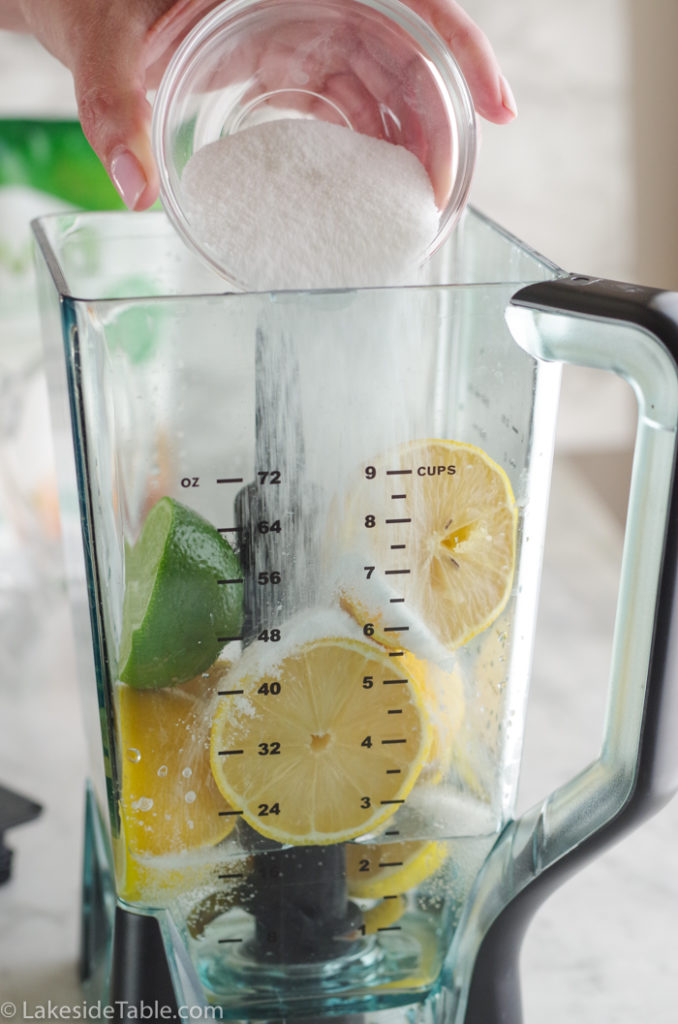 5 second lemonade - pouring sugar into blender with lemons and 1 lime