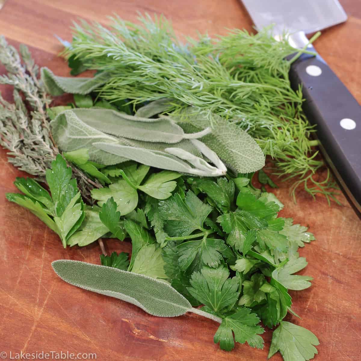 fresh herbs on cutting board