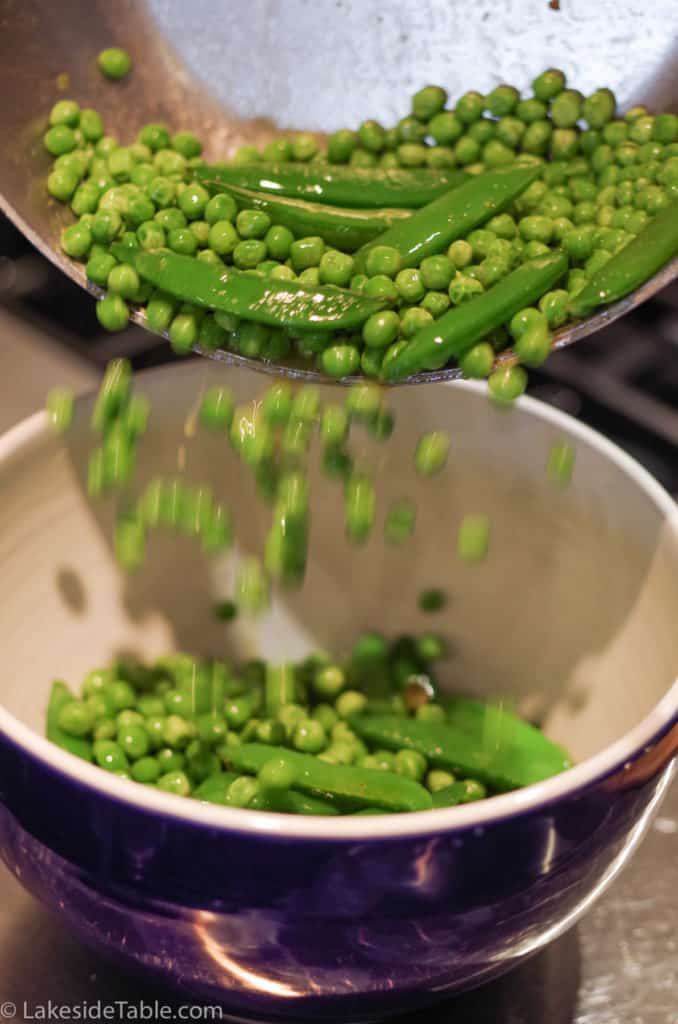 transfering peas to a bowl