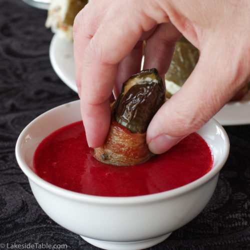pickled jalapeño popper dipping into chipotle raspberry sauce