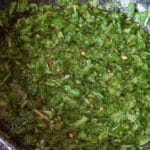 bowl of chimichurri sauce with flecks of red pepper
