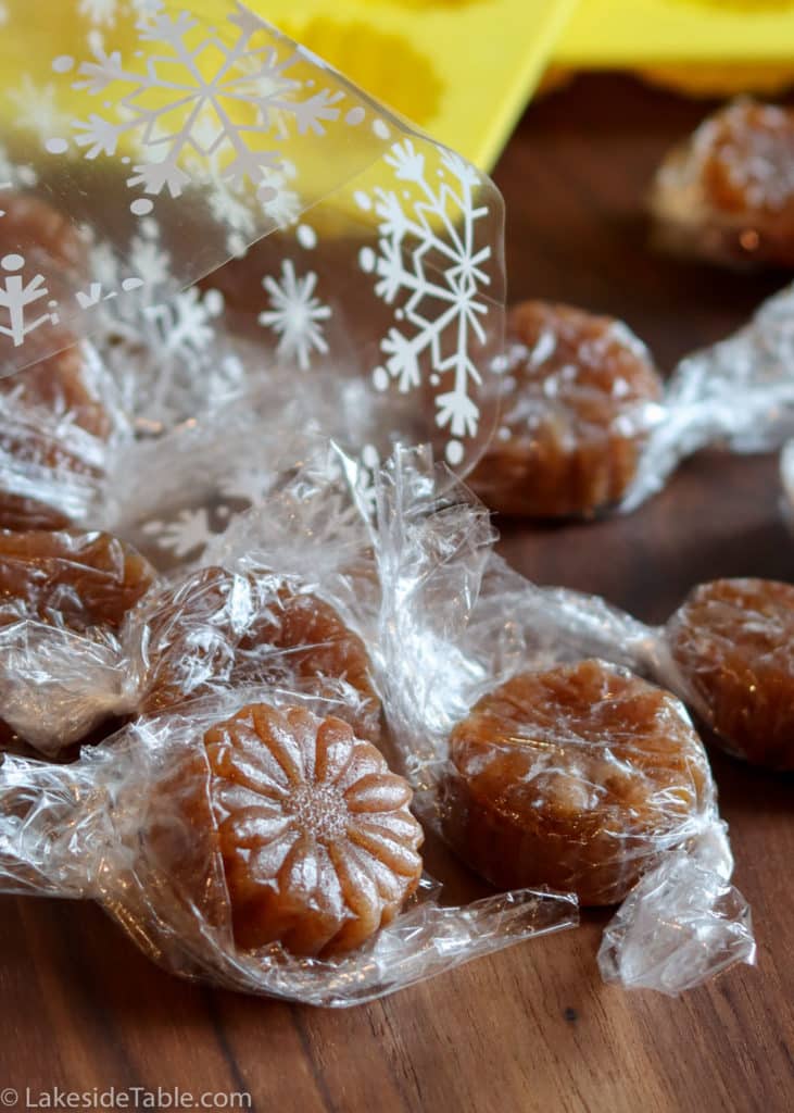 persimmon candy caramels falling out of plastic bag