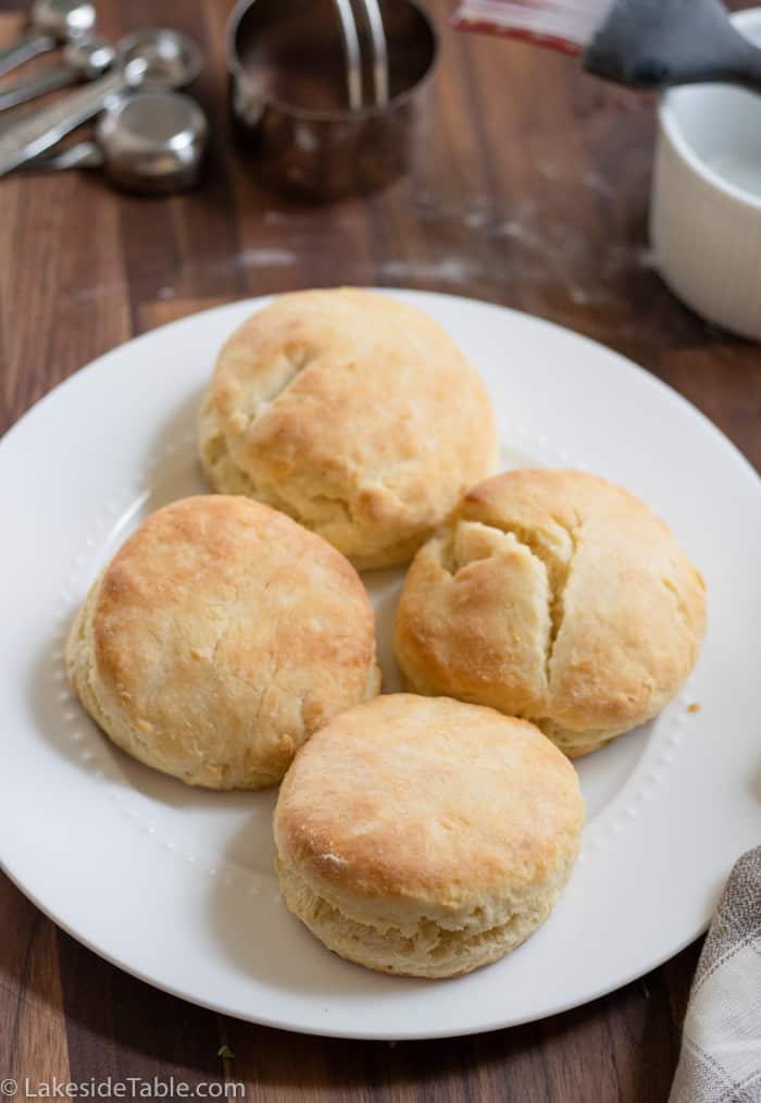 four biscuits on a white plate