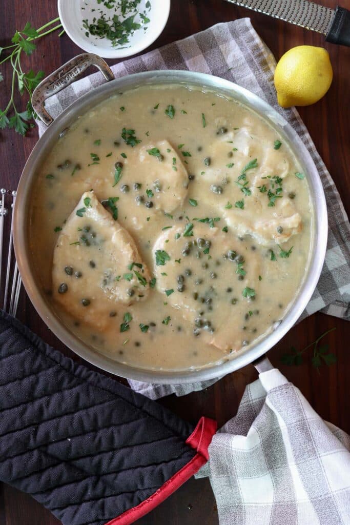 top down chicken piccata in a pan