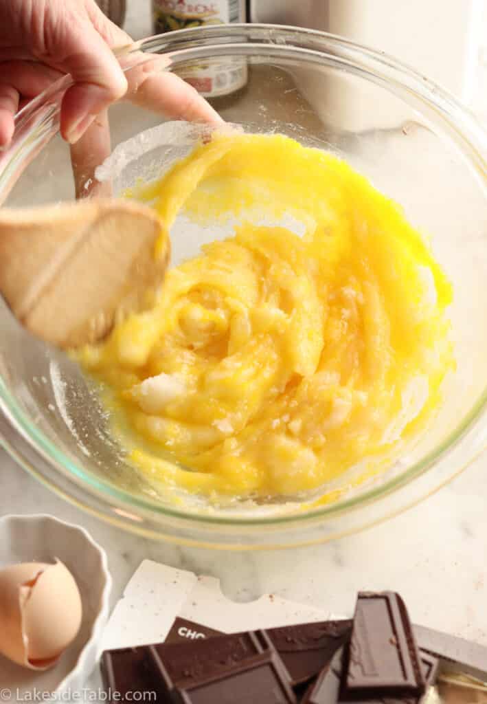 mixing butter into sugar mixture