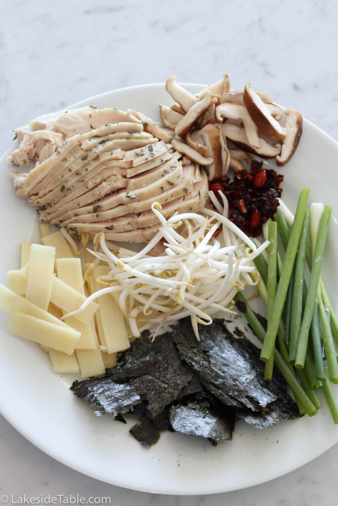 optional toppings: sliced cooked chicken, fresh shiitake mushrooms, scallions, nori, bamboo, and bean sprouts