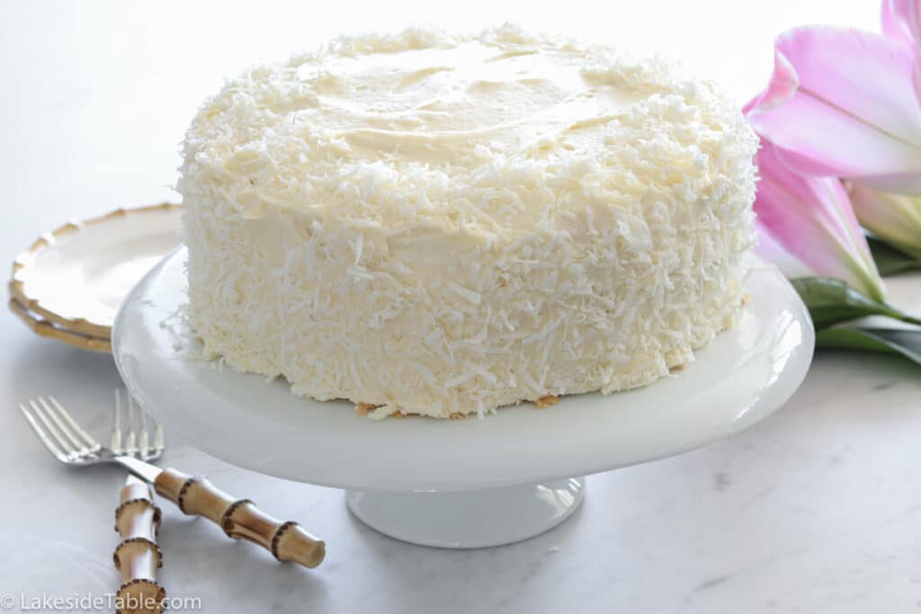 coconut cake on a clean cake plate