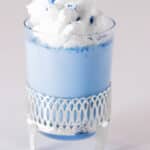 Blue magik panna cotta with whipped cream and blue powder magik