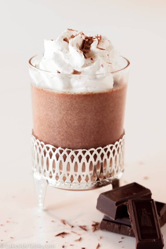 Chocolate panna cotta with whipped cream and chunks of chocolate