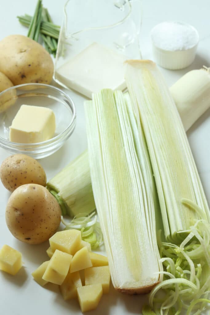 process shot for recipe with ingredients laid out: fresh leeks, butter, potatoes, and cream
