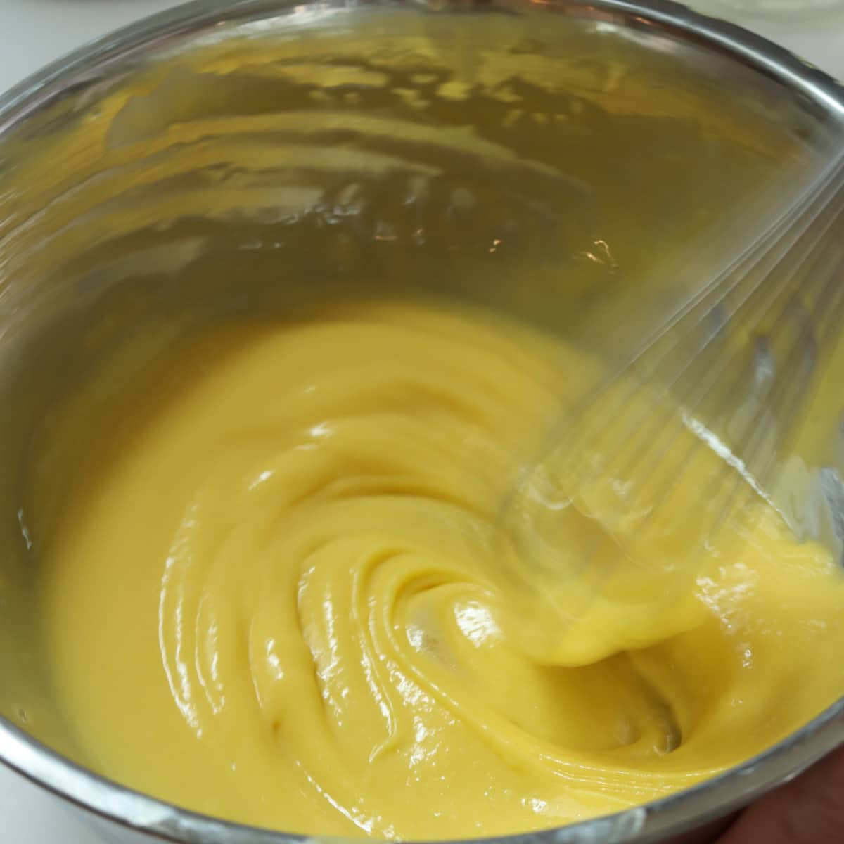 whisk the oil into the yolks until thick