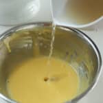 add broth to the yolk oil liasion