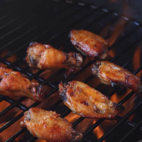 sous vide chicken wings being finished on the grill